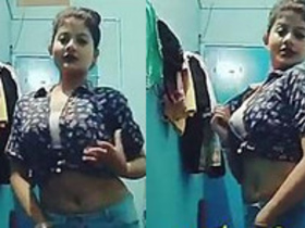 Busty Instagram model shows off her toned body in a tie-dye shirt