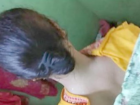 A new village bhabi gets spied on while taking a bath