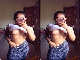 A beautiful woman captures intimate selfies of her breasts for a special someone