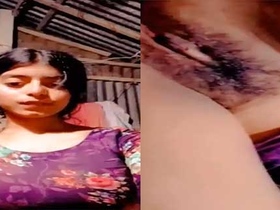 A beautiful girl flaunts her attractive genitals