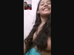 A beautiful Indian girl displays her assets