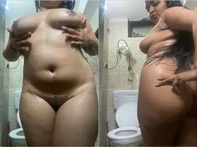 Busty babe flaunts her naked body and soaps up in the shower
