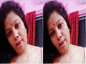 Horny Desi Budi flaunts her large breasts on camera