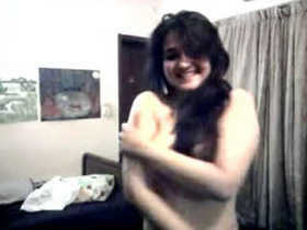 A college student stripping down for a steamy video
