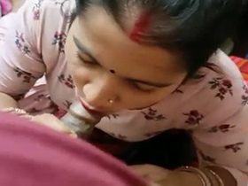 Dehati, a newlywed housewife, performs a blowjob on camera
