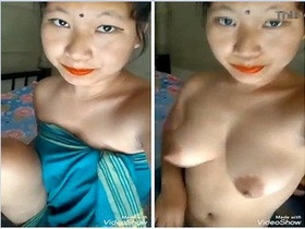 Watch a gorgeous girl strip down and reveal her breasts and pussy in this exclusive video