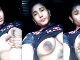 Busty babe flaunts her assets in a seductive manner