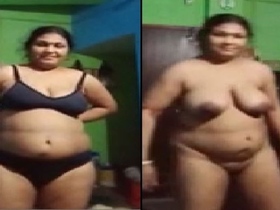 Older auntie from the village bares her body