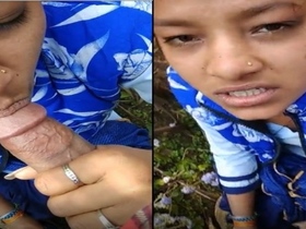 Cute Indian girl gives a blowjob in the wild