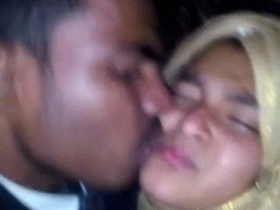 Young couple shares a passionate MMS kiss in an amateur video