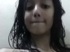 Watch a cute girl get naked in the bathroom