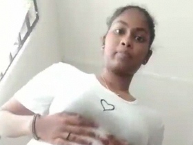 Tamil girl strips naked and pleasures herself with her natural pussy