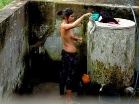 Cute Indian babe takes a bath behind closed doors