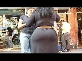 Mexican hottie answers a question on the street