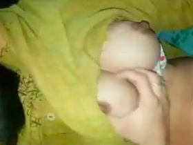 Bhabhi flaunts her breasts in a seductive manner