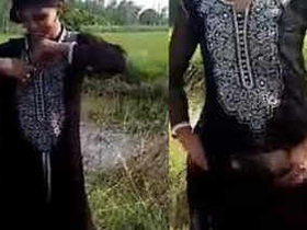 Indian girl flaunts her big breasts and pussy in outdoor video