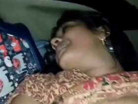 A hot couple gets frisky in the back seat of a car