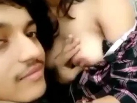 Lover's sensual smooching and breast play