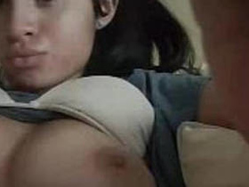 Watch this cute girl flaunt her natural breasts