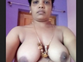 Tamil woman takes a bath in the bathtub