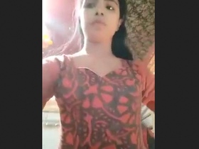 Babe in a suit flaunts her assets in a steamy video