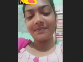 Cute brunette with huge tits shows off her assets