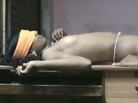 Andhra babe gives a blowjob on a table