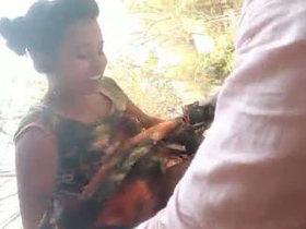 Desi couple rides on a bike in the village for a video