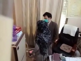 Doctor examines patient's breasts by feeling them through her blouse