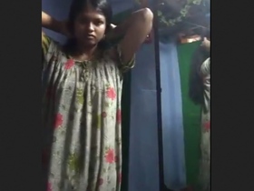 Tamil girl with slim figure changes her clothes in front of camera