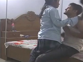 Teenage couple meets in college dress for video