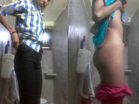 A girl in a toilet changing her outfit in a desi video