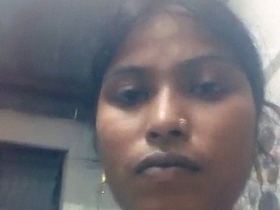 Local Bangladeshi beauty in a sari pleasures herself with her fingers