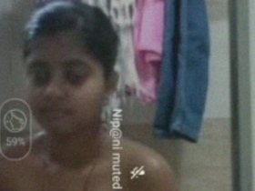 Naked Indian woman enjoys bathing in the bathroom