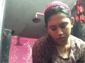 Watch a stunning Bangladeshi babe take a shower and get naked in a video