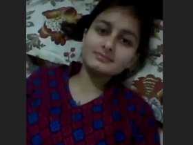 Horny girl masturbates with her hands and boobs
