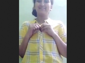 Teen girl undressing for lover in video