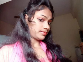 A Tamil girl enjoys a nude bath in a steamy video