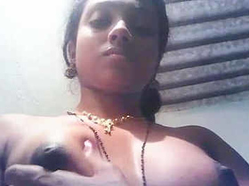 Horny Tamil girl squeezing her big boobs and nipples