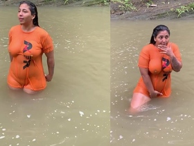 Watch a gorgeous woman show off her large breasts in a seductive T-shirt