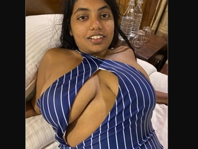 Watch a stunning busty model in a seductive outfit
