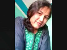 Watch as Aasam Bhabhi reveals her breasts and pussy in a steamy video