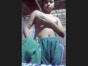 A nude video of a Desi girl stripping and teasing her lover in a slum