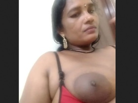 Watch a hot bhabhi show off her big boobs